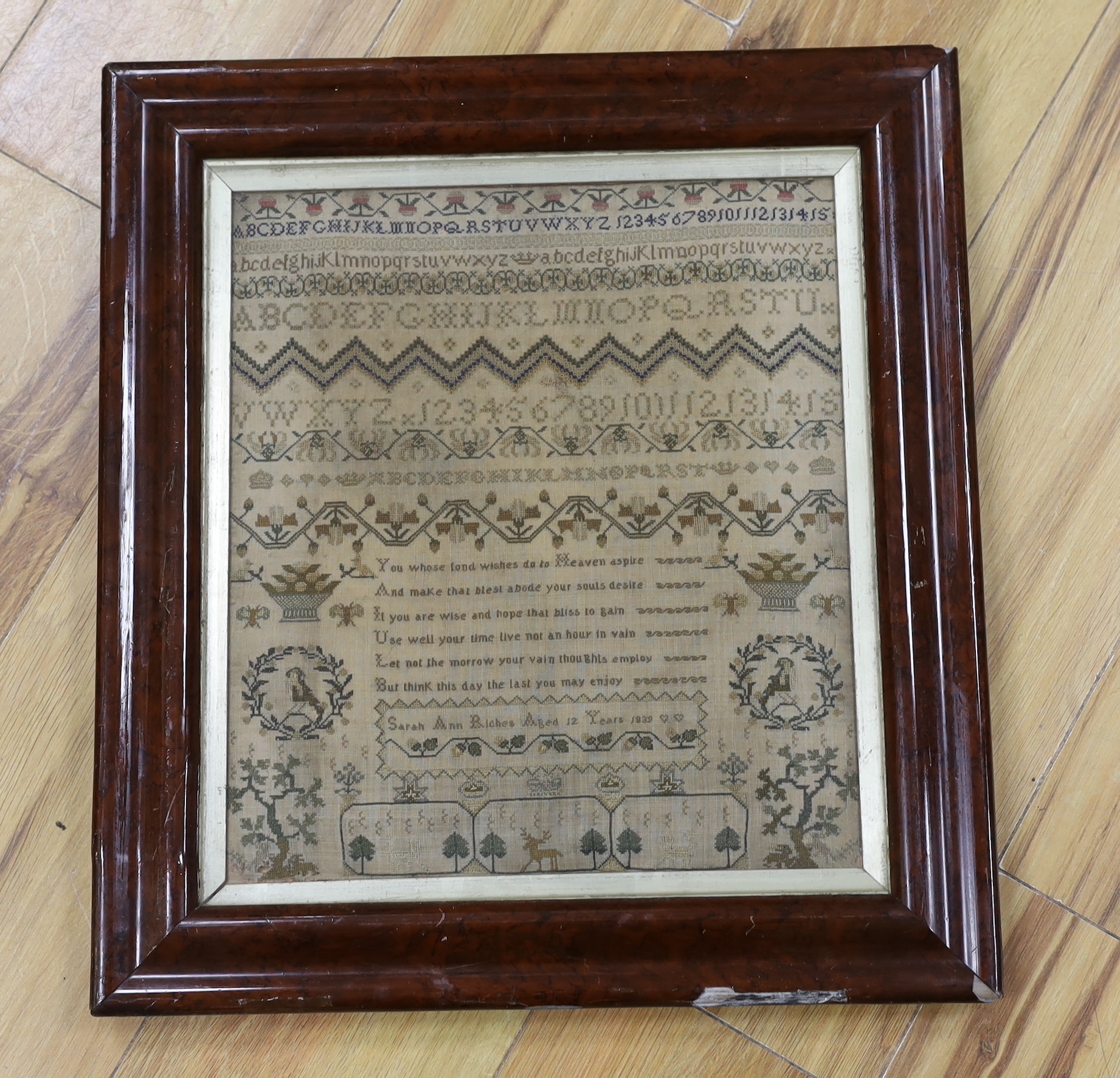 A framed early Victorian very finely worked cross stitch alphabet and spot motif sampler, dated 1839, by Sarah Ann Riches aged 12 years, 30cm wide x 33cm high